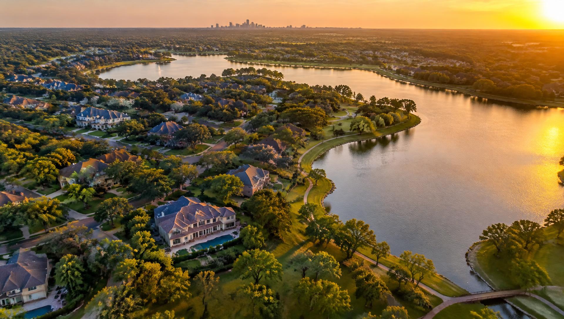 Aerial view of Shaded Waters lakes and homes at sunset